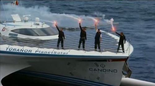 PlanetSolar crew celebrate with flares just before docking ©  SW